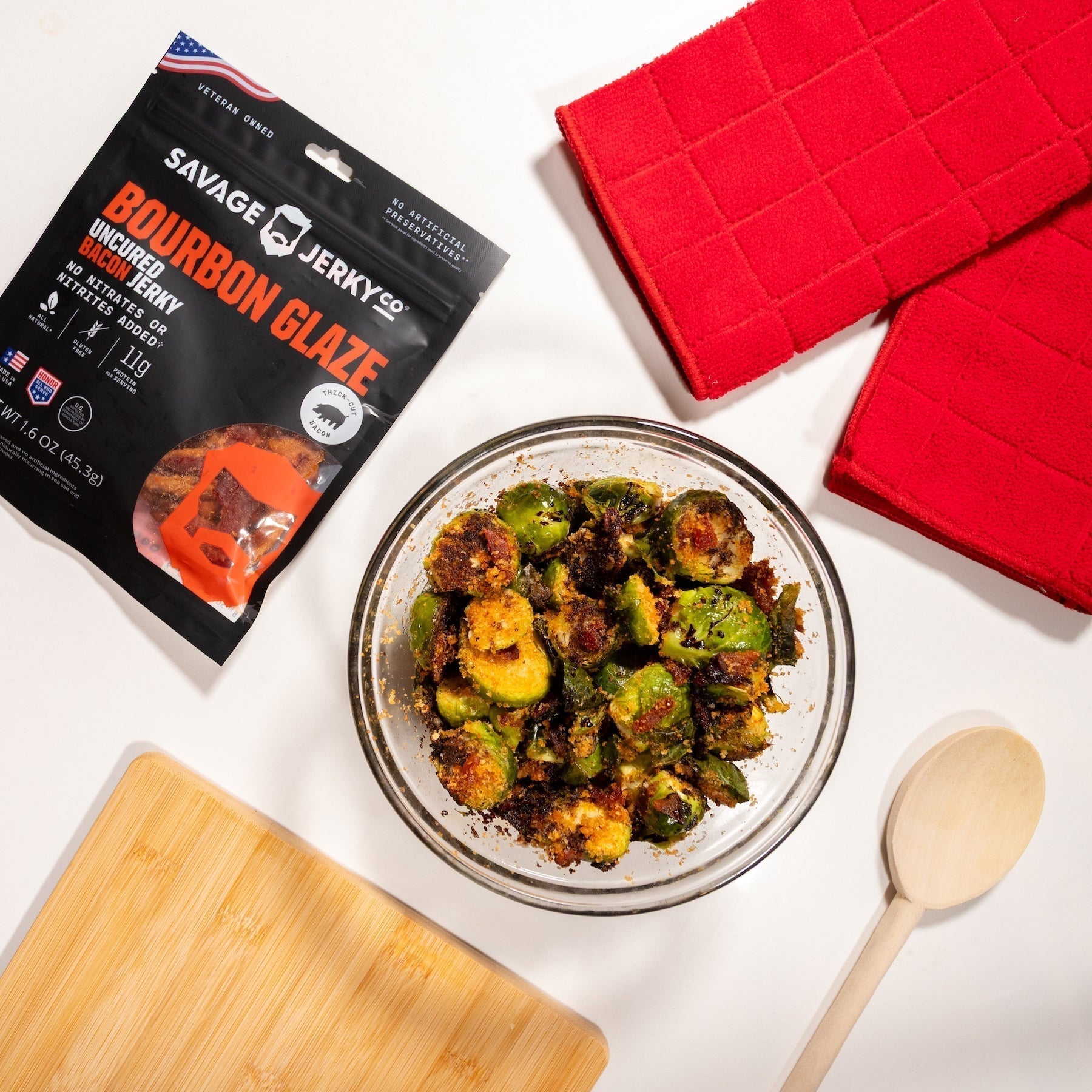 a bowl of crispy brussels sprouts with bourbon glaze bacon jerky